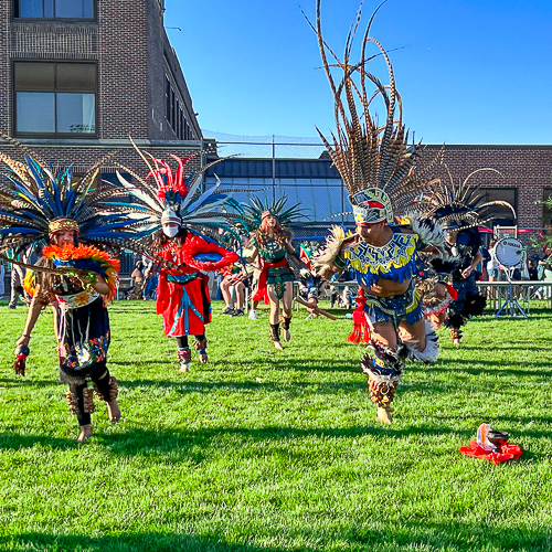 Native dancers performing at Roosevelt High School.